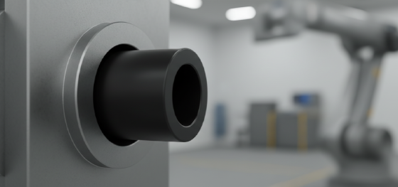 Black machined acetal bushing being press-fit into a heavy steel robotic joint Black machined acetal bushing being press-fit into a heavy steel robotic joint