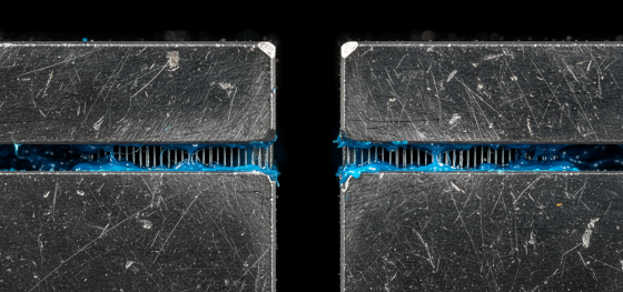 Exhausted P20 tool steel parting line choked with hardened blue polymer resin inside air vents Exhausted P20 tool steel parting line choked with hardened blue polymer resin inside air vents