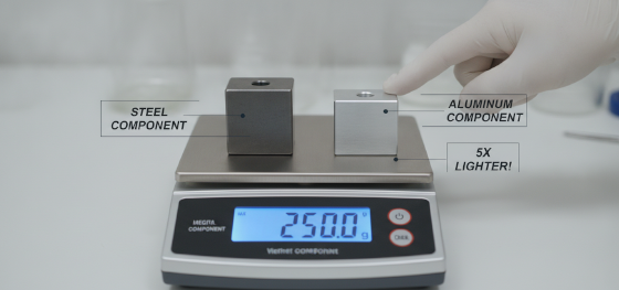 weighing metal brackets on scale