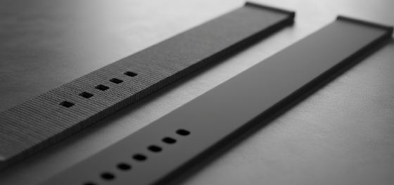 Texture comparison between rough FDM extruded layer lines and uniform matte laser sintered watch straps