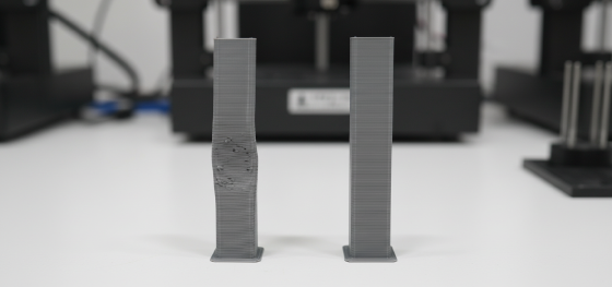 Comparison between a warped thin vertical bracket and a perfectly straight component